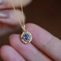 Royal style gold necklace with mixed gemstone pendant on adjustable copper box chain