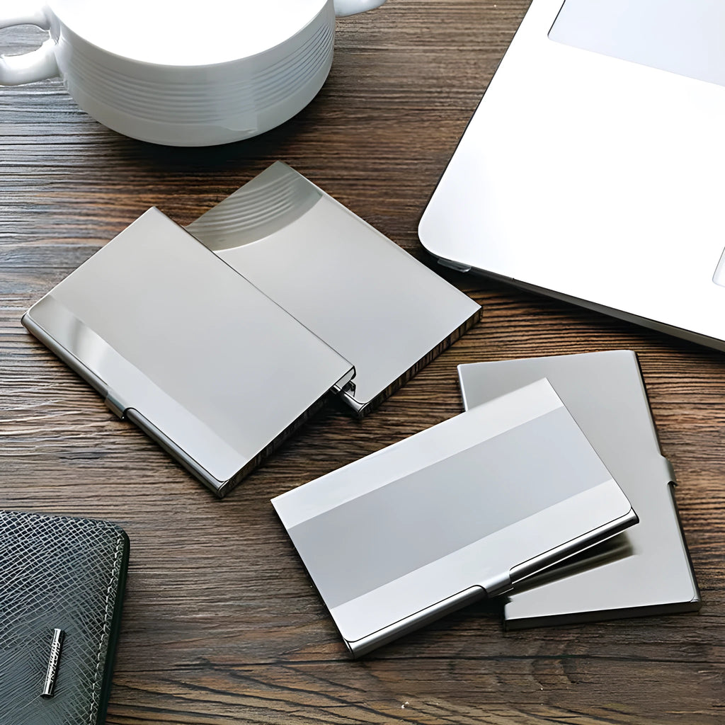 Geometric stainless steel business card case showing bevel, brushed, and mirror finish options.