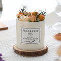 Aromatherapy candle with dried flowers decoration, showing gift box with wooden base and single candle options.