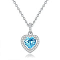 Sterling silver heart pendant necklace with a natural gemstone on an adjustable cross chain.