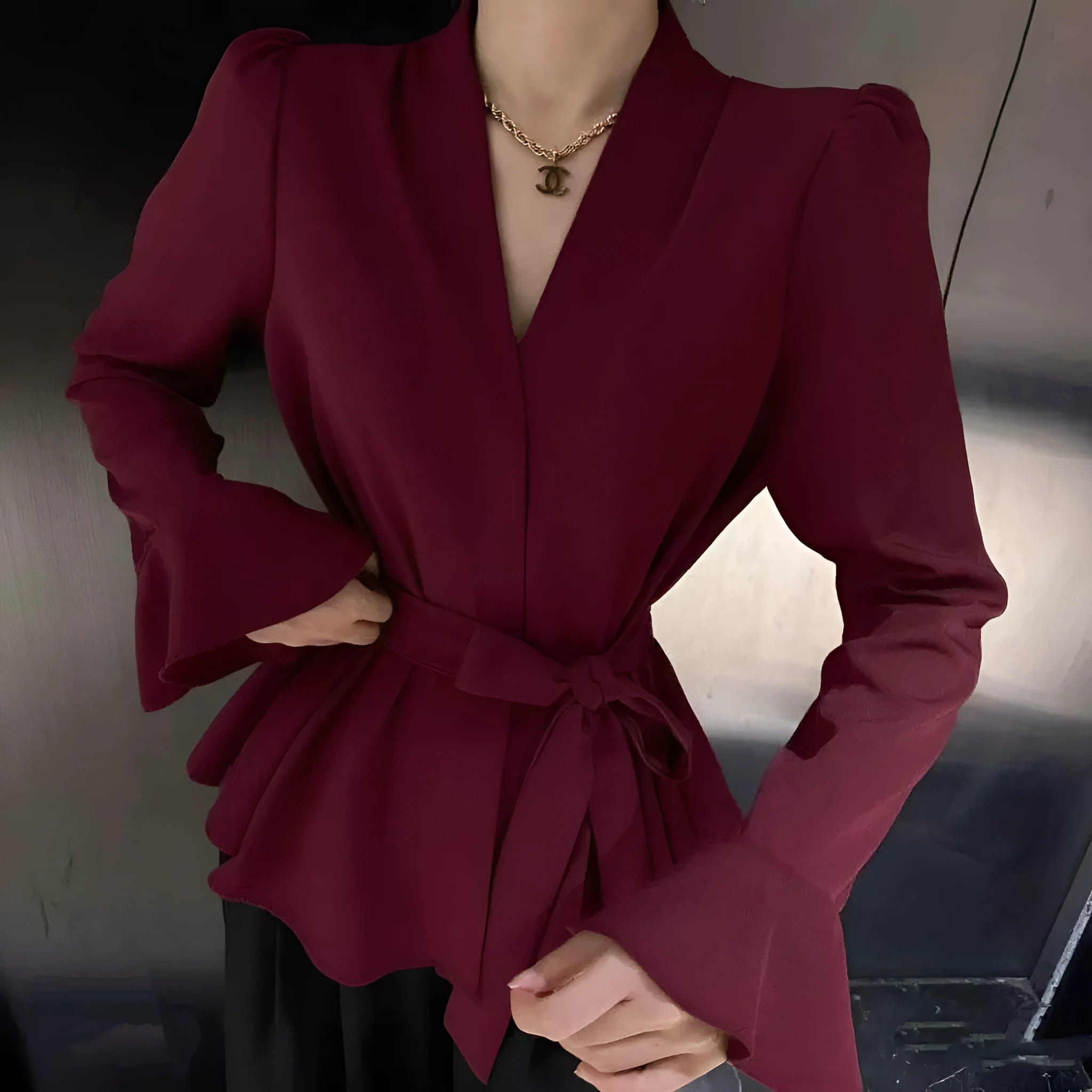 Women's French-style shirt with irregular collar, bell sleeves, and tied front in polyester fabric