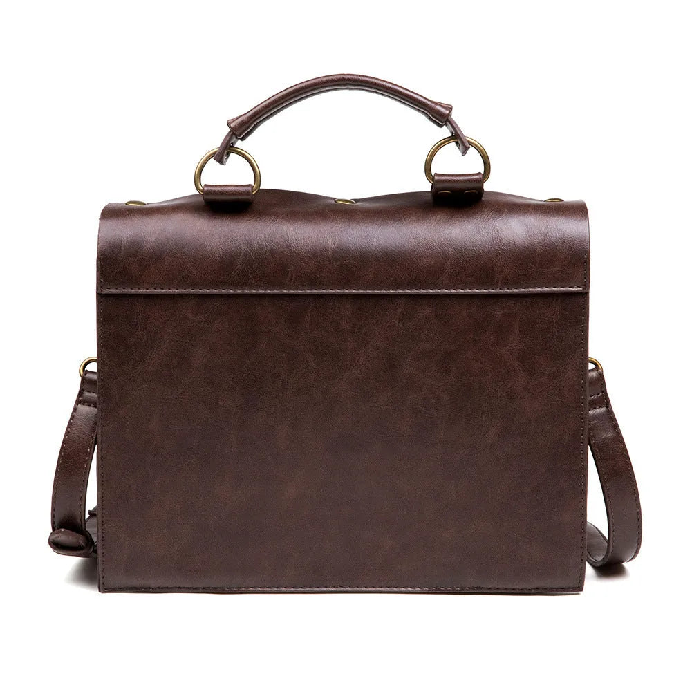 Bronze steampunk pillow shoulder bag with metal hardware on a textured PU leather surface.