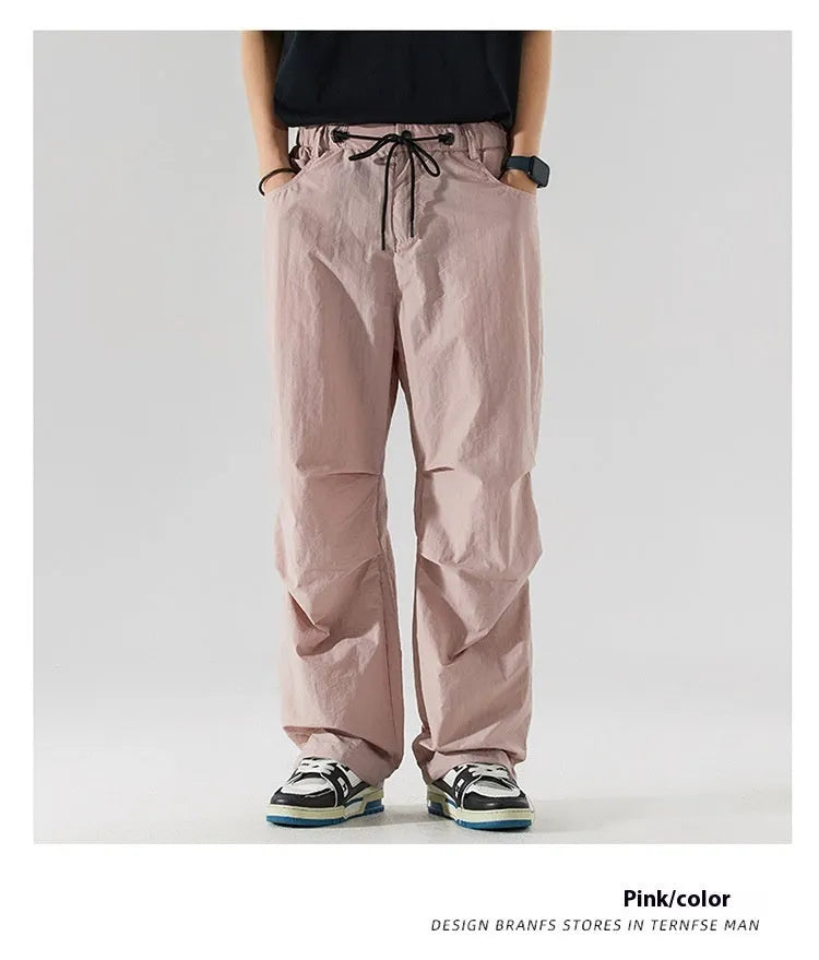 Men's straight-leg casual trousers in lightweight nylon fabric, shown in multiple colour options.