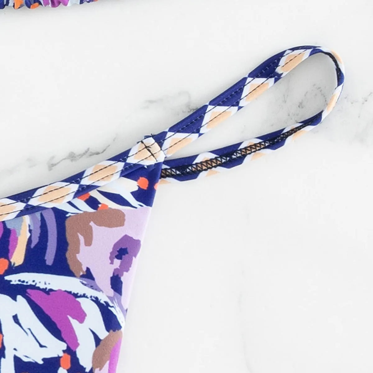 Women's floral print polyester bikini swimsuit with triangle cup top and briefs style bottoms