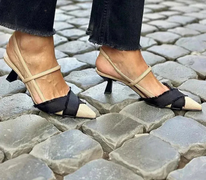 Women's apricot and black colour block stiletto heel sandals with pointed toe and buckle fastening.