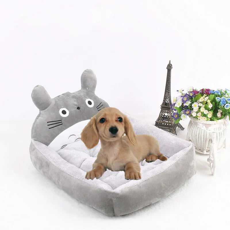 Cartoon print washable pet sofa bed for a small dog or cat, shown in blue, brown, gray, pink, or yellow.