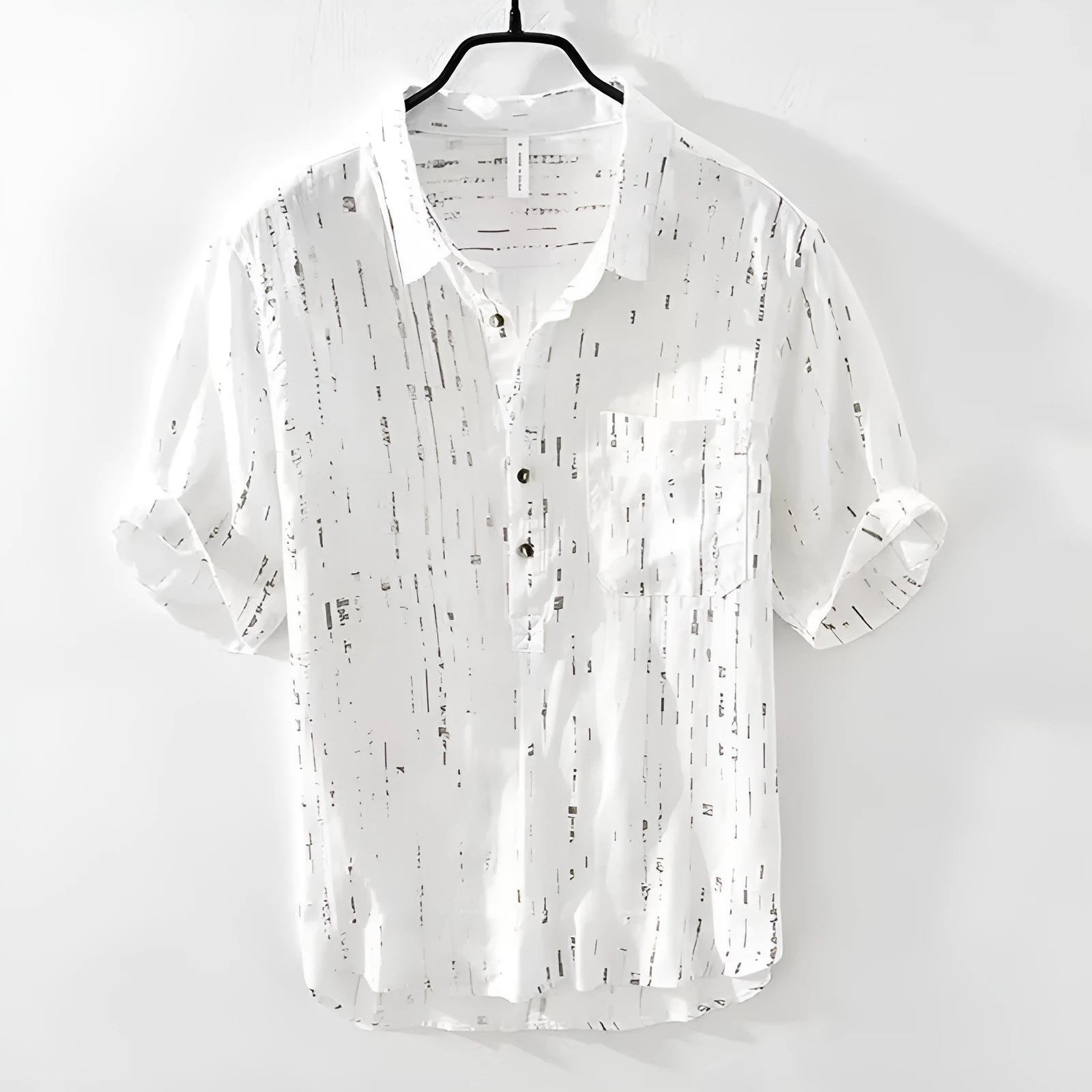 Men's black loose-fit short-sleeved polo shirt with a lapel collar on a hanger.