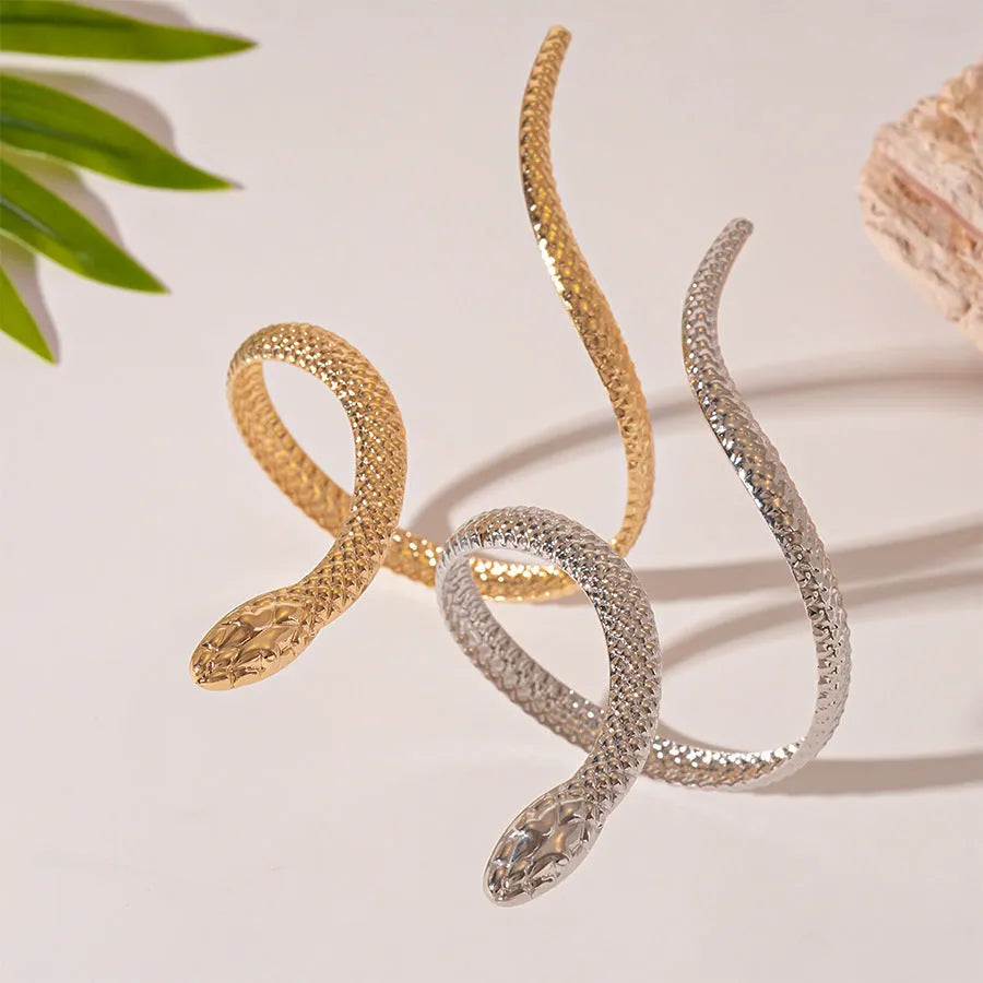 Gold tone simulated snake jewellery set with twisted winding ring and bracelet