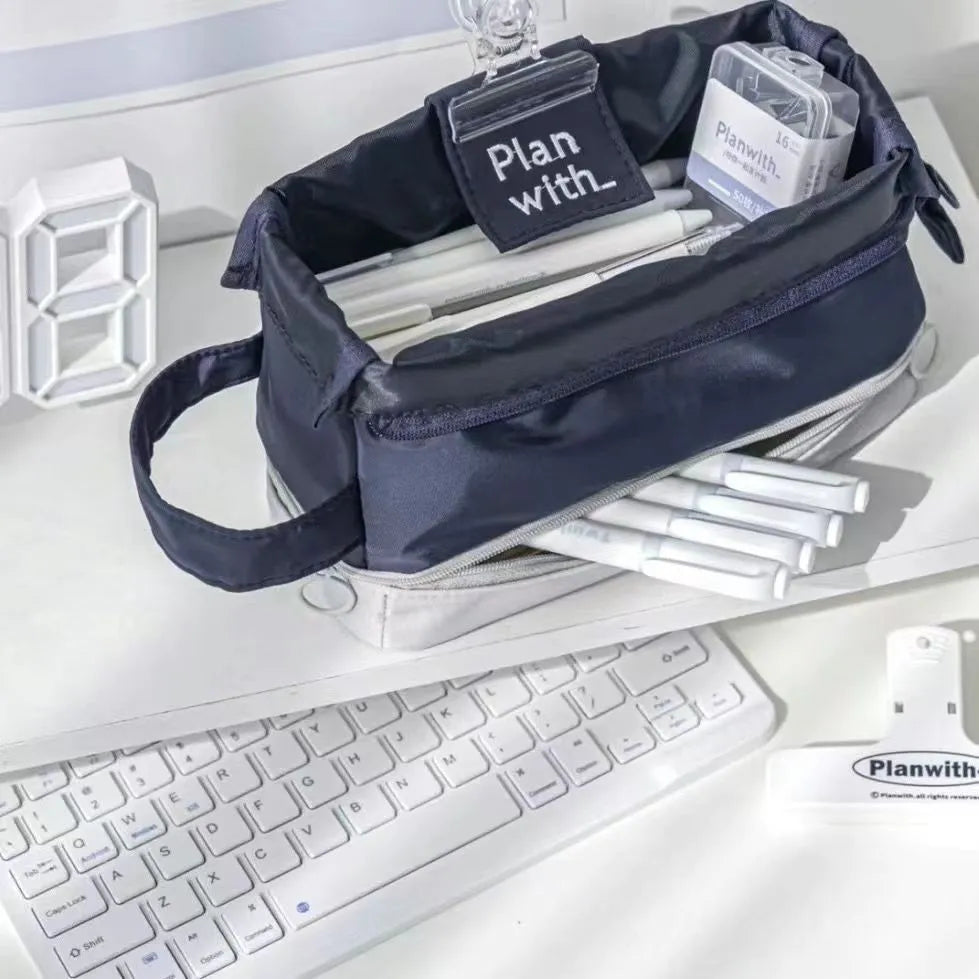 Folding double-layer student pencil case in polyester fabric, shown in dark blue, blue, and cream white colour options.