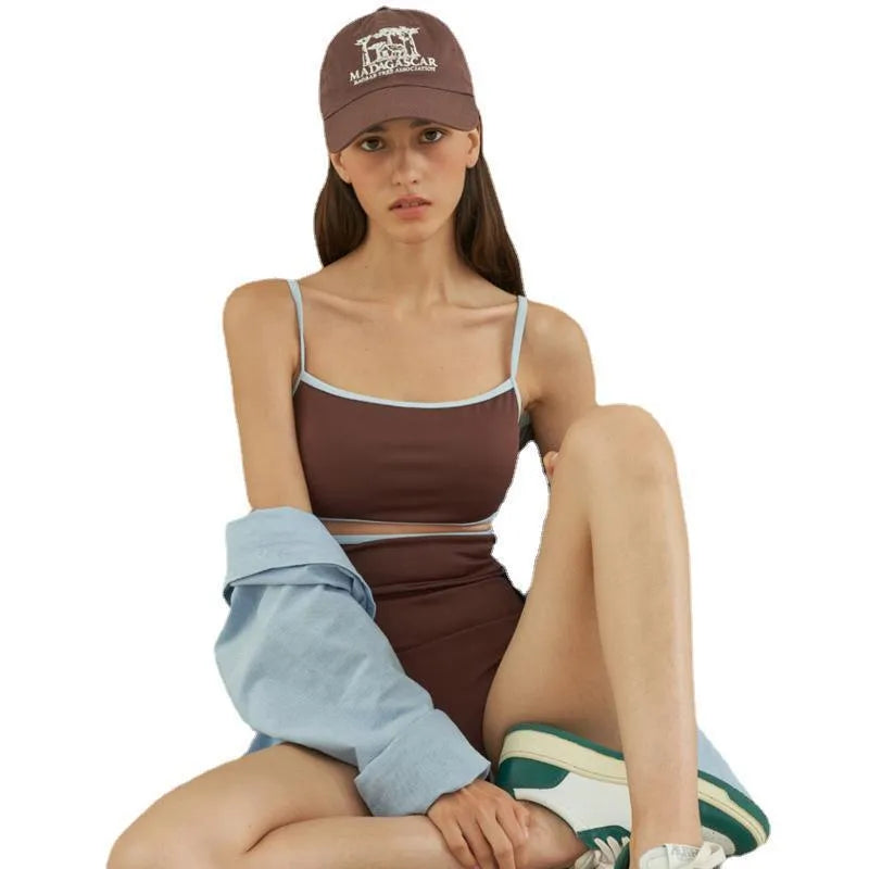 Brown women's one-piece swimsuit with a triangle top on a mannequin