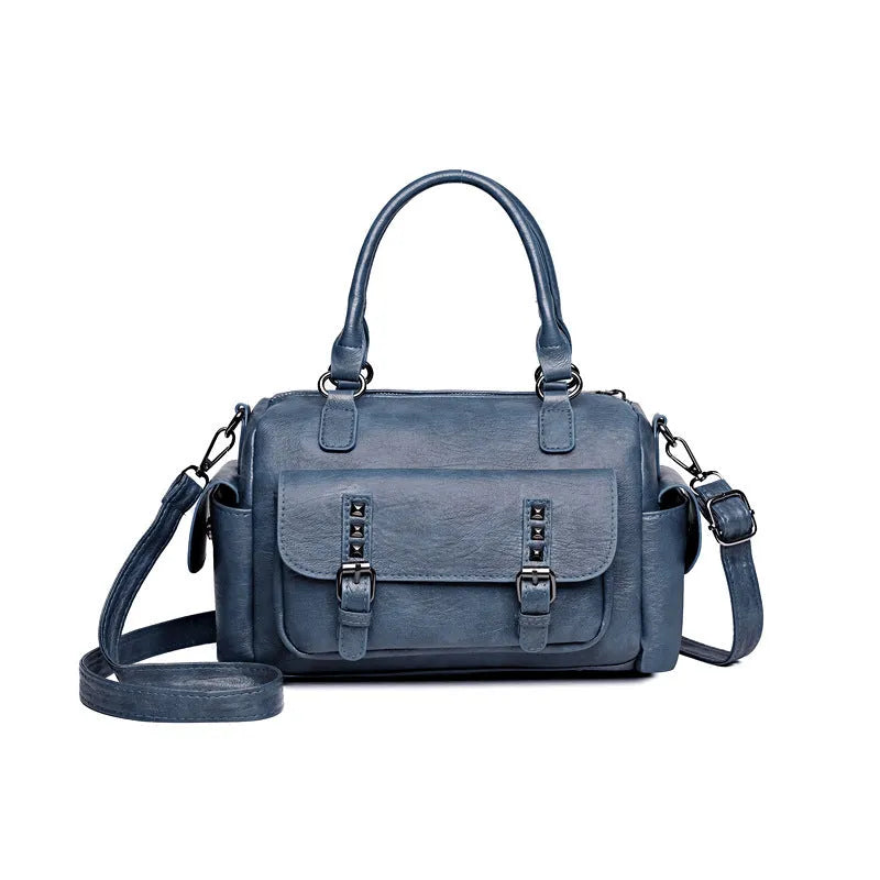 Vintage style large capacity square messenger bag in PU leather with contrast stitching.