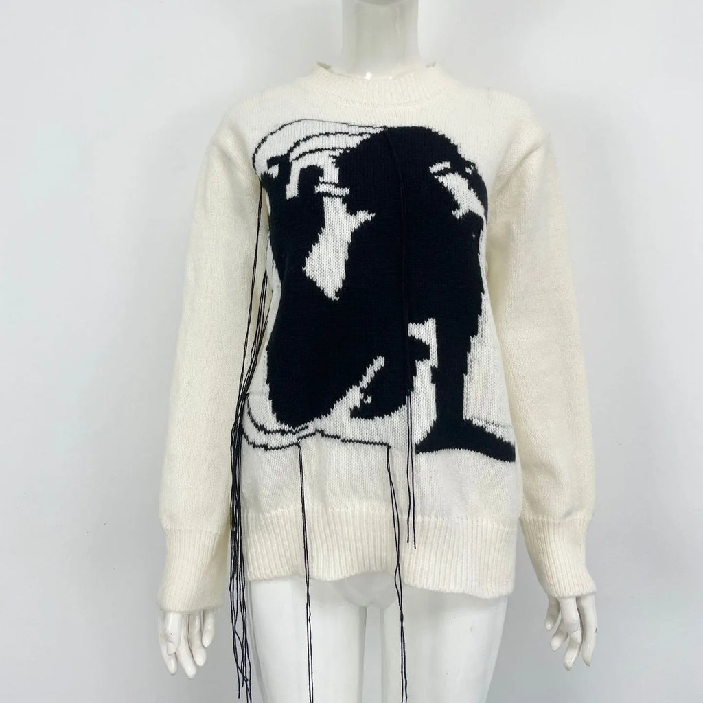 Women's loose fit alpaca wool sweater with tassel details and abstract pattern in street fashion style