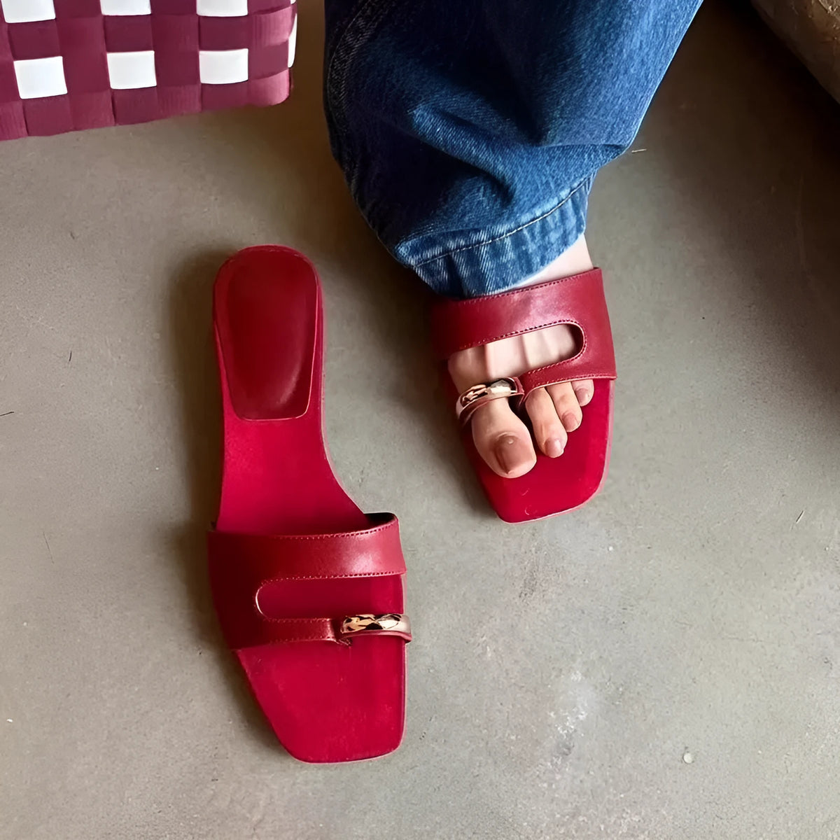 Leather upper outdoor slipper with square scaffolding toe and rubber sole in black, red, silver, and white.