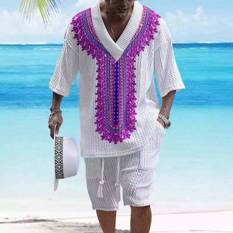 Man wearing a printed drop-shoulder knitted short sleeve top with matching shorts, a casual two-piece loungewear set.