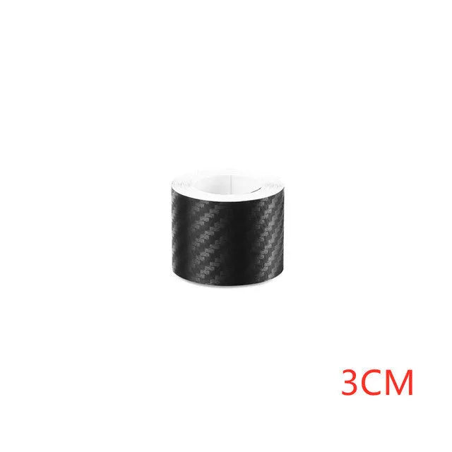 Roll of matte black 3D carbon fibre adhesive tape for protecting car door sills, showing width options.