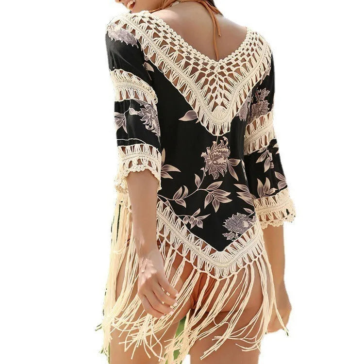 Women's apricot sun protection blouse with v-neck and hollow-out sleeves laid flat.