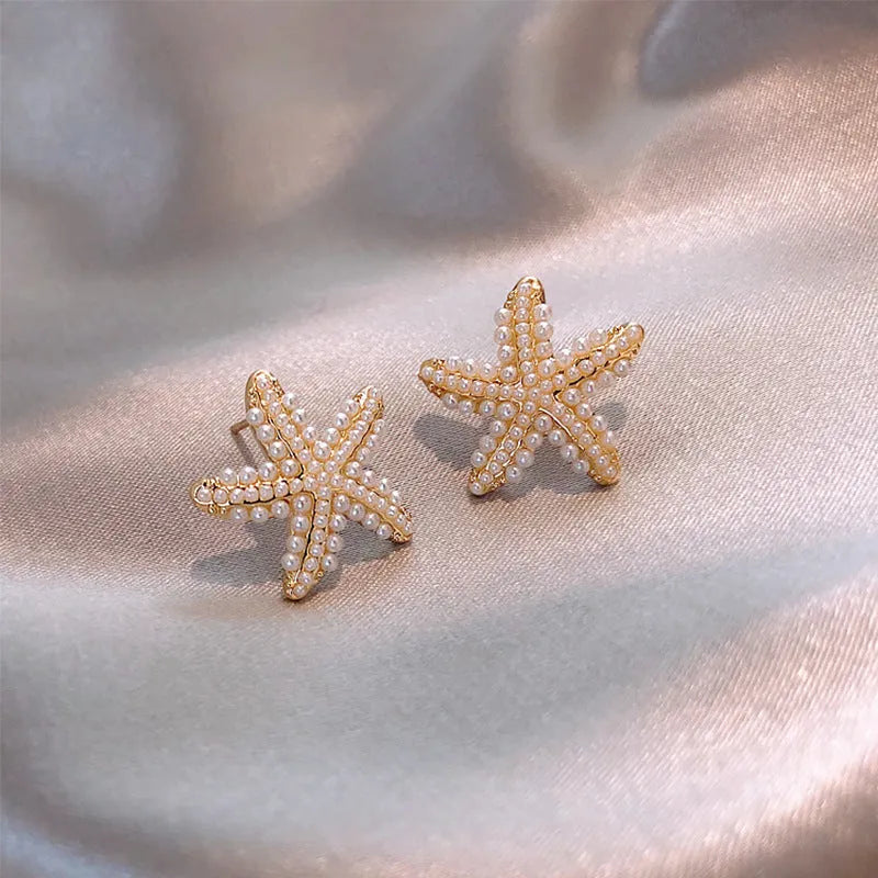 Korean-style pineapple starfish pearl earrings in electroplated alloy with decorative gemstones.