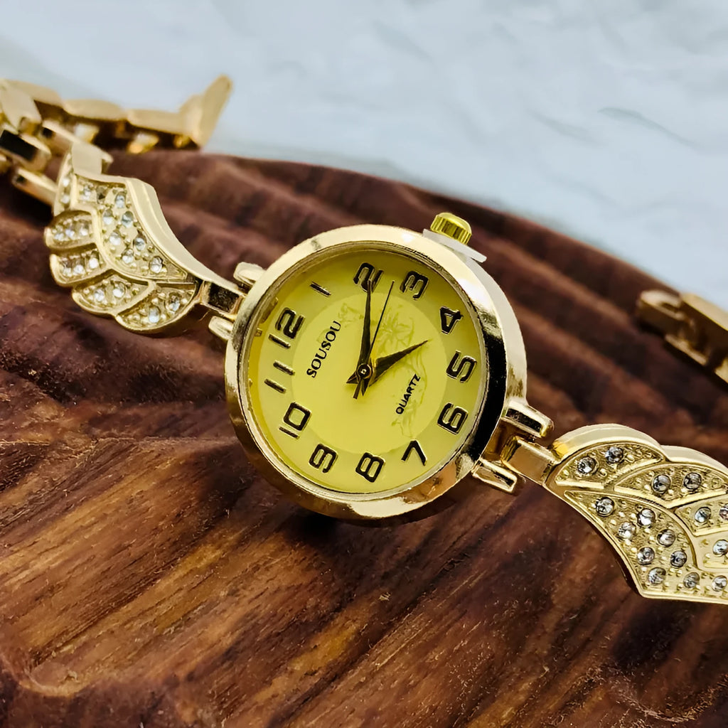 Round stainless steel women's watch with gold dial surface and Vachette clasp buckle