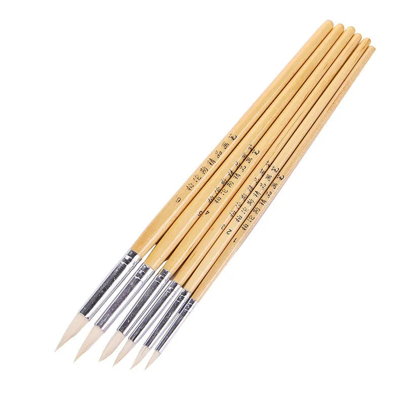 Set of six wooden-handled artistic pen brushes with pointed wool bristles for calligraphy and detailed painting.