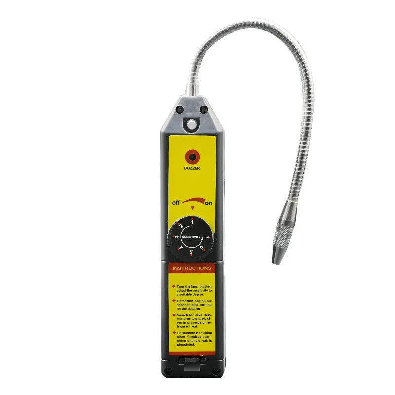WJL-6000 handheld electronic halogen leak detector with a long black probe on a workshop bench.