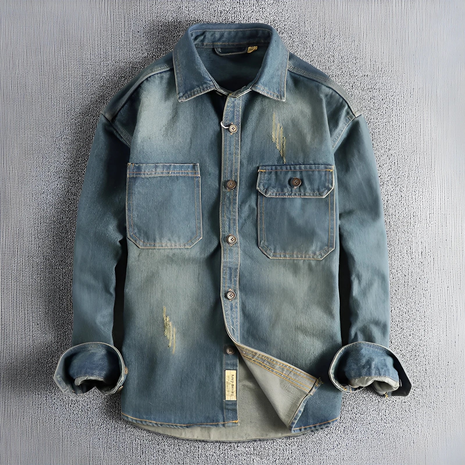 Man wearing a light blue loose-fit vintage denim shirt with long sleeves, cardigan style.