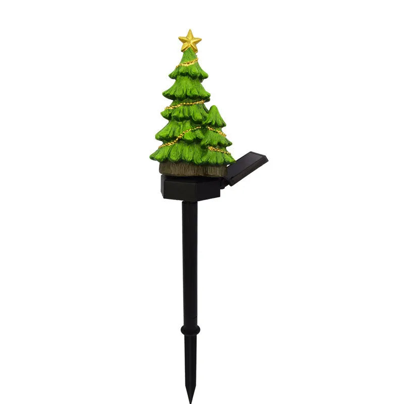 Solar Christmas tree ground plug light with warm white LED, resin body and 40 x 40mm solar panel for outdoor garden use.