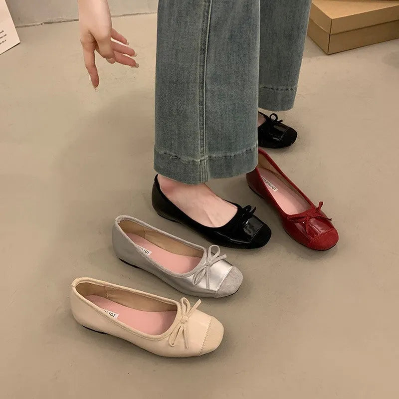Women's wine red Mary Jane flats with square toe, decorative bow, and a low rubber sole.