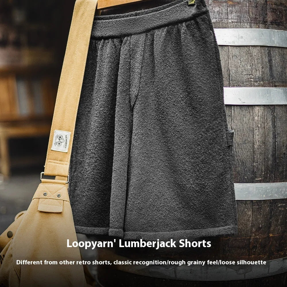 American-style heavy grey straight-leg sports shorts with elastic waistband on a solid background
