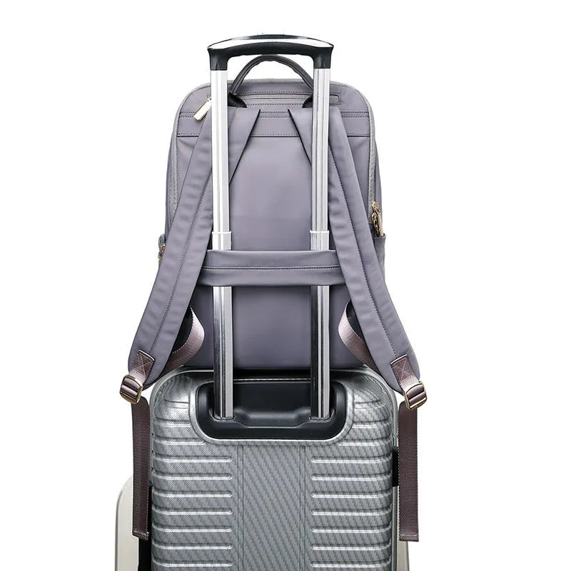 Oxford cloth women's backpack in black and purplish grey colours, showing large main compartment.