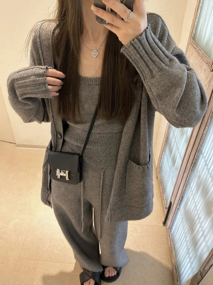 Women's loose-fit knit cardigan, vest, and trousers three-piece set in wool blend fabric.