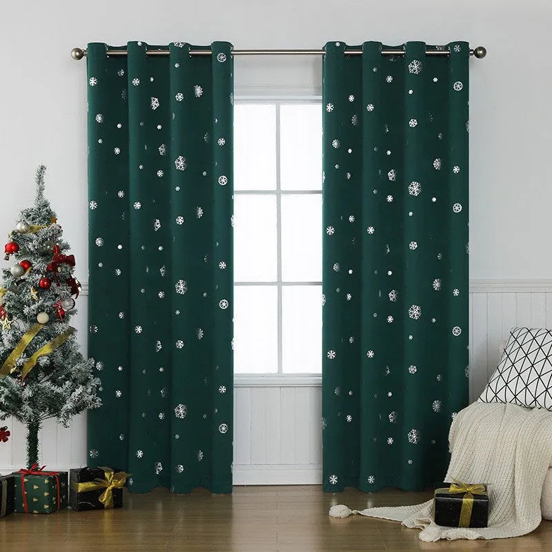 Red snowflake pattern shade cloth curtain with lace loops hanging against window