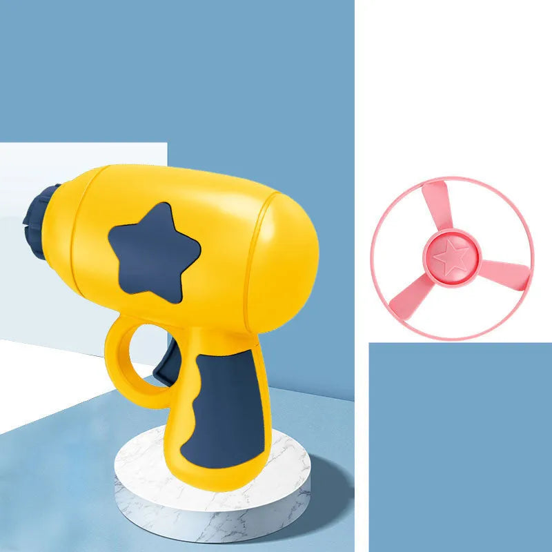 Flying saucer launcher toy set with plastic disc shooter gun, flashing discs, and target board, in blue, navy, pink, and yellow