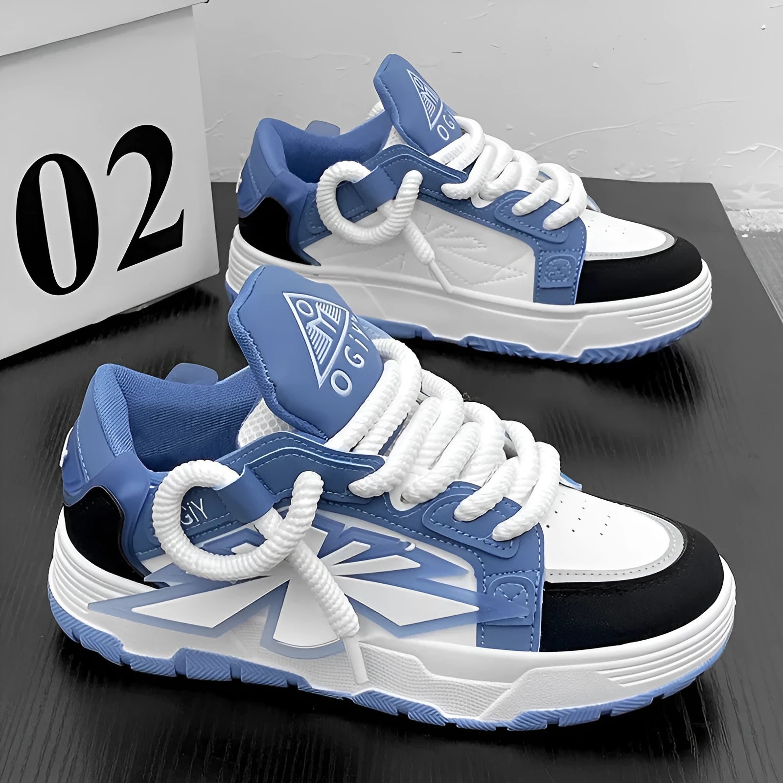 Men's white chunky sneakers with cartoon pattern, thick rubber sole, and lace-up front.