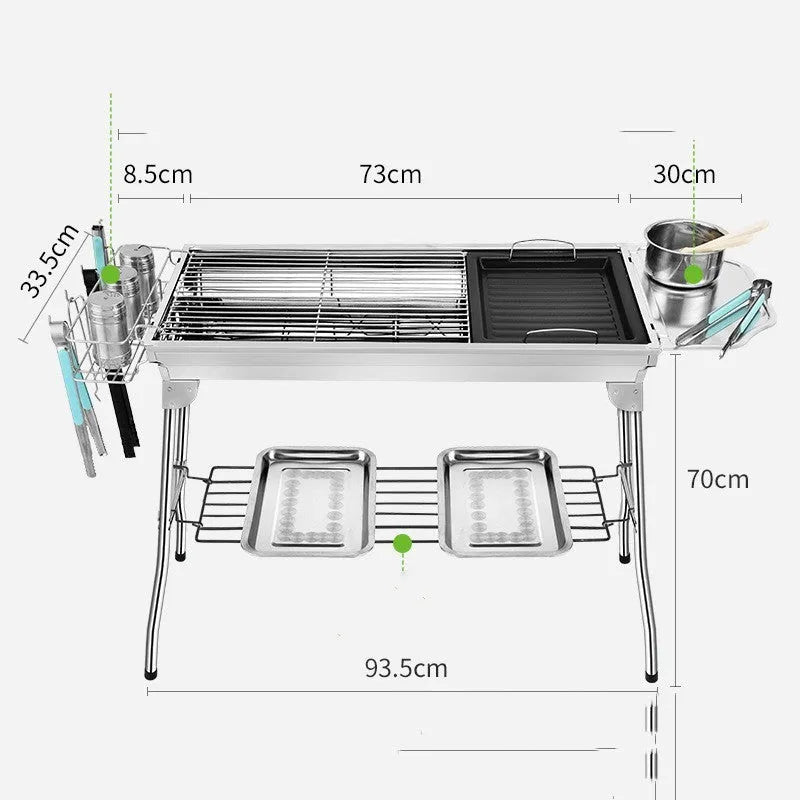 Stainless steel portable folding barbecue grill oven set up outdoors.