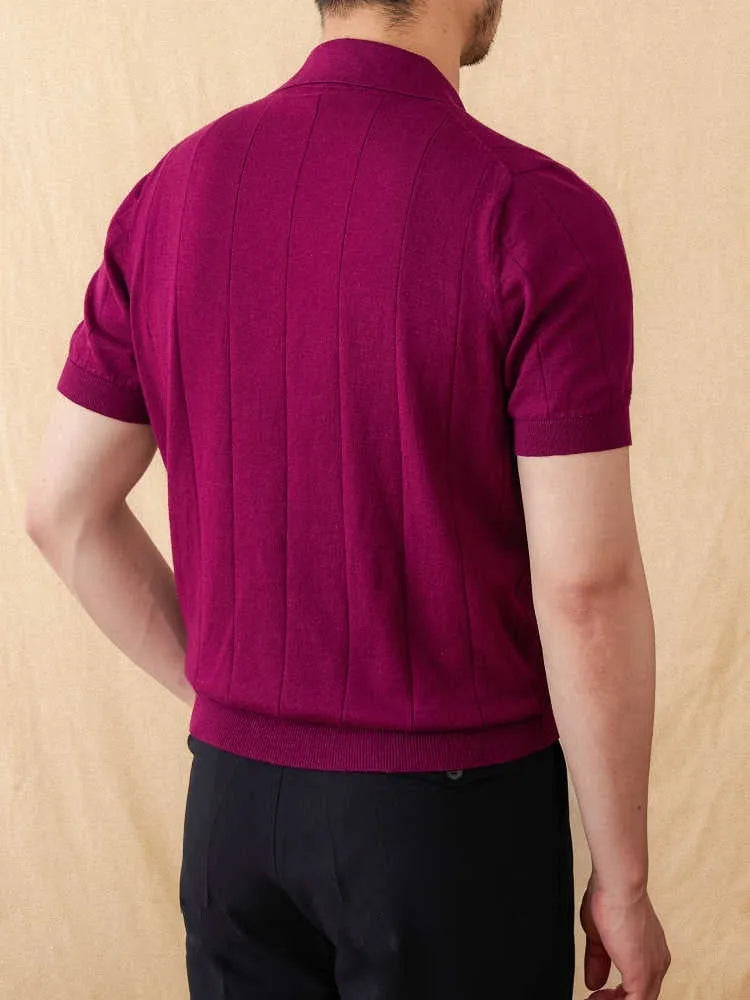 Man's purple short sleeve polo shirt with seagull collar and sunken stripe knitted texture.