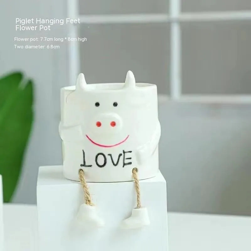 Ceramic hanging foot flowerpot in cartoon style for succulent plants on desktop