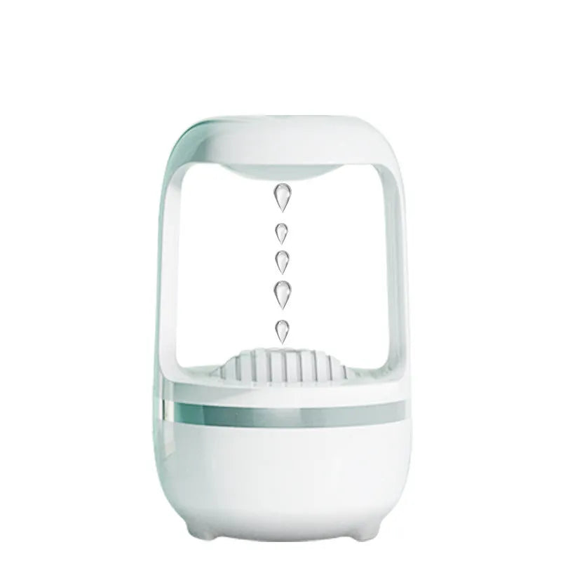 White anti-gravity humidifier showing water drop backflow effect with USB cable connection