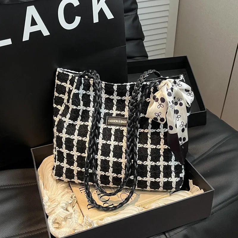 Black wool shoulder bag with horizontal square shape and internal organisation compartments