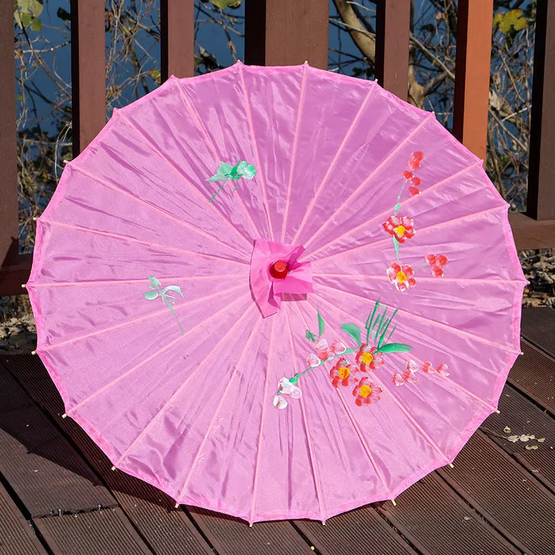 Handmade Chinese-style silk dance umbrella with wooden pole, available in ten colours and four diameters.