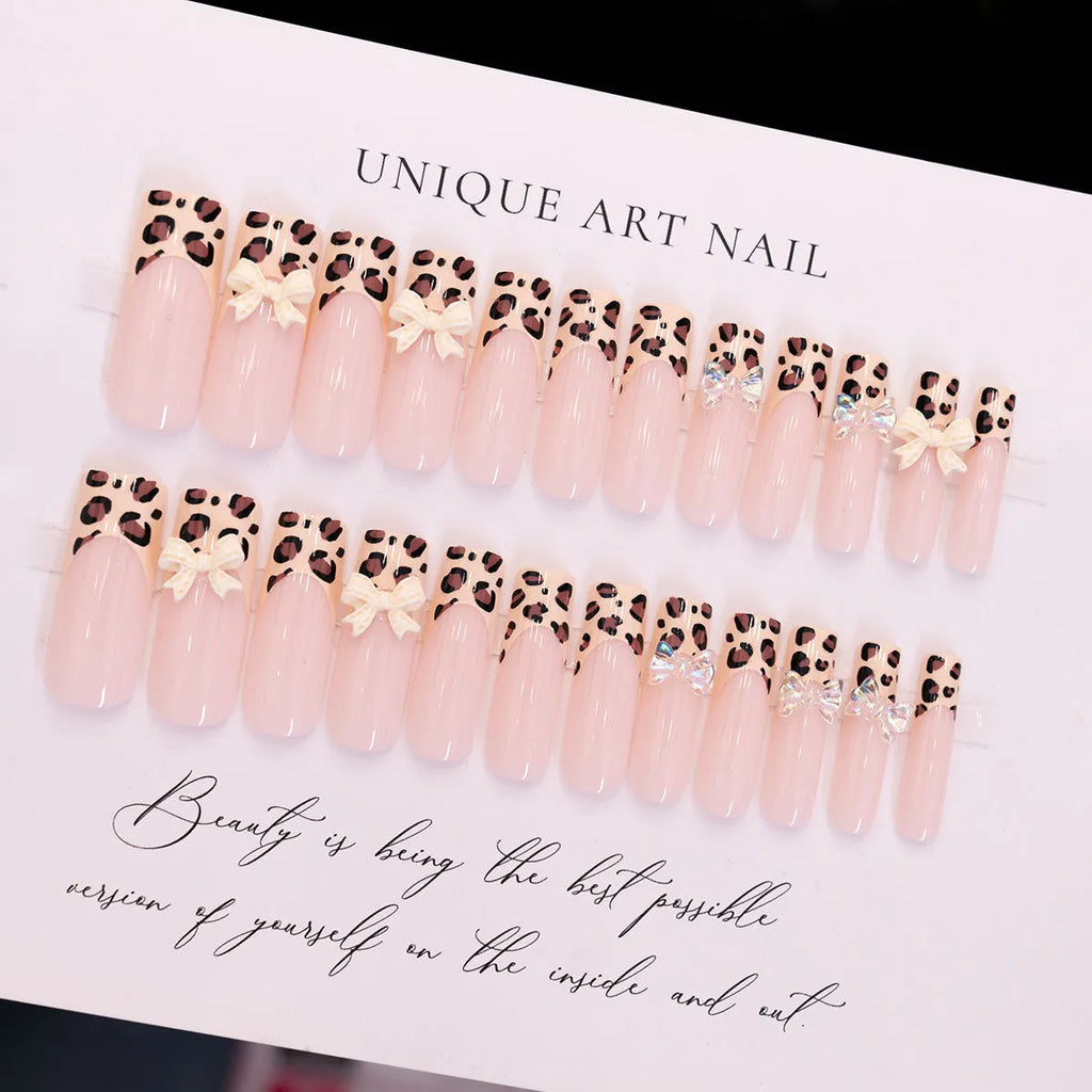Leopard print false nails with butterfly decorations in colour WM296