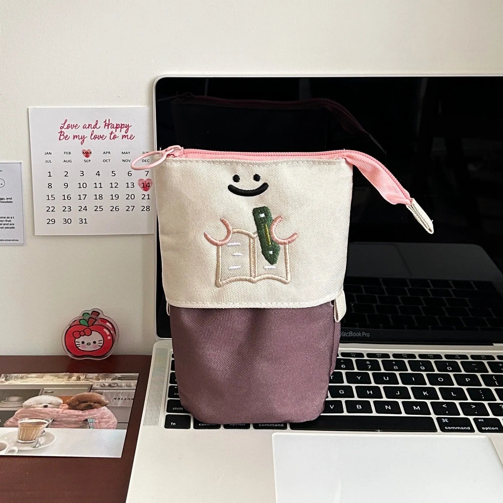 Brown collapsible pencil case with cartoon print, showing 17cm by 14cm size.
