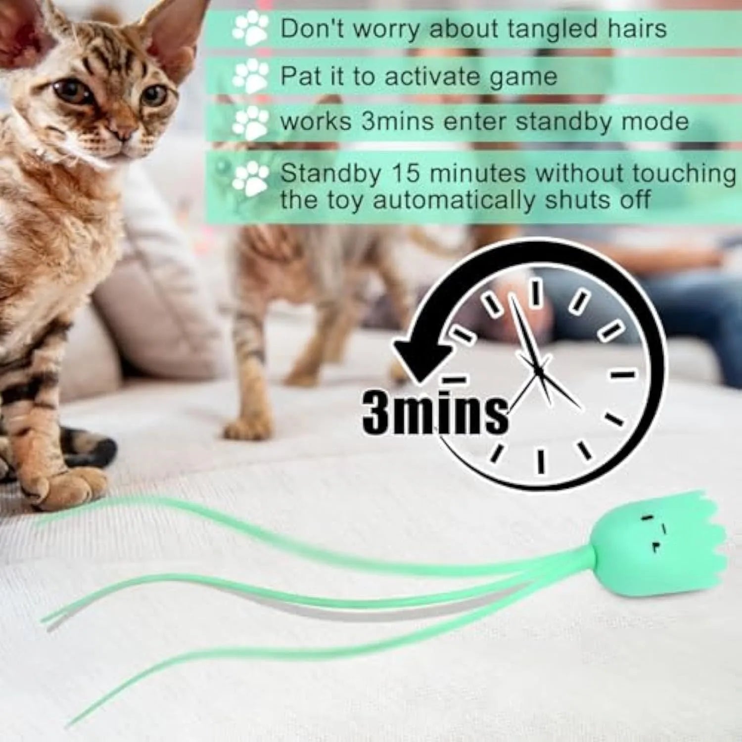 Green automatic electronic cat wand toy with swinging silicone tails on a table