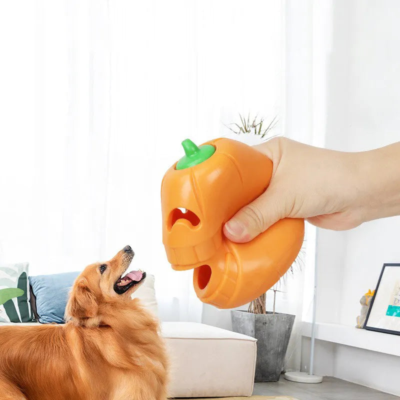 Orange Halloween pumpkin shaped dog chew toy with treat dispensing funnel