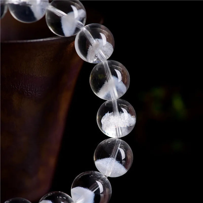 Women's white crystal ghost pyramid bracelet with ruyi element on wrist