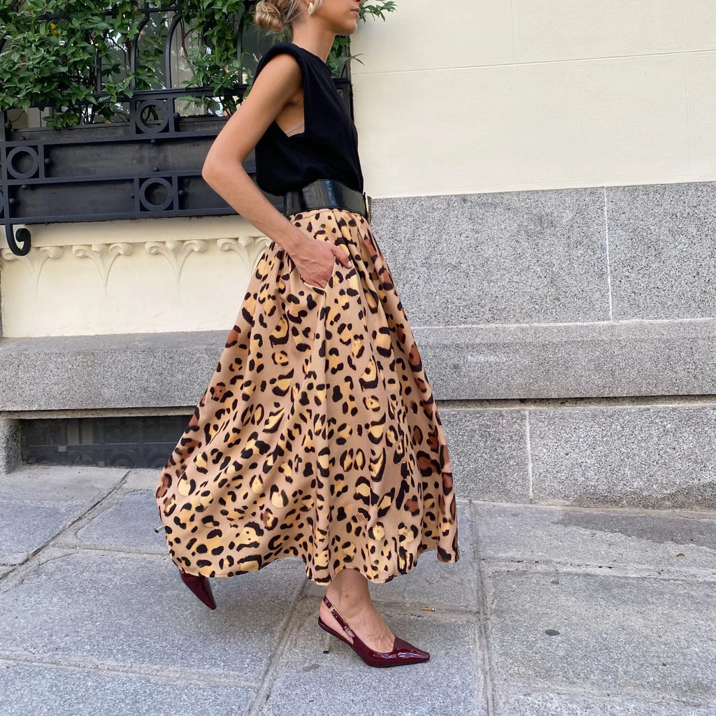 Women's brown leopard print A-line long skirt with big hem detail and animal pattern design