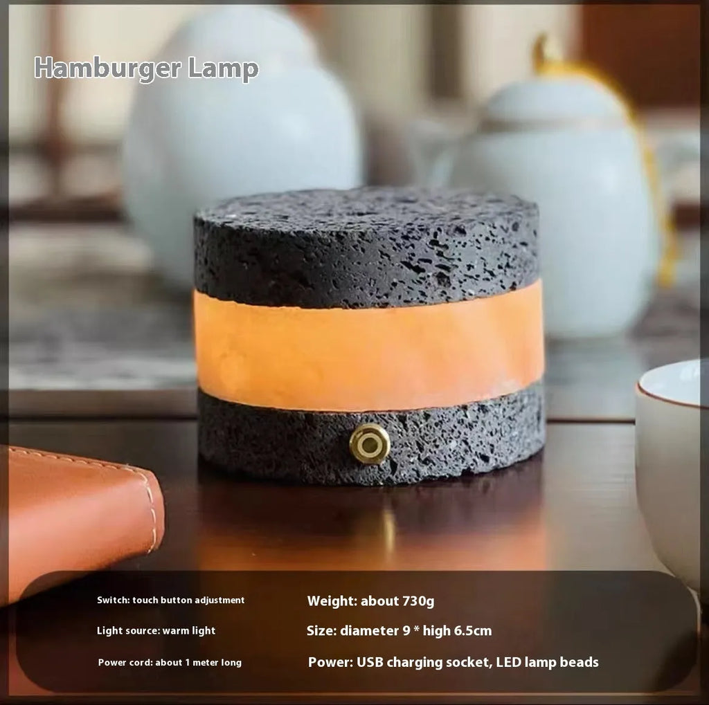 Small orange volcanic rock touch night lamp with USB port and essential oil reservoir.