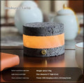 Small orange volcanic rock touch night lamp with USB port and essential oil reservoir.