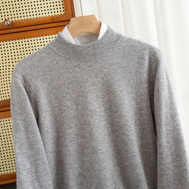 Men's chunky knit half-turtleneck wool sweater in camel colour with cable stitch detail.
