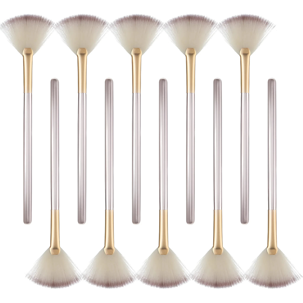 Ten professional champagne-coloured facial fan brushes with acrylic handles and protective covers.