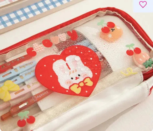 Transparent TPU pencil case with rabbit and heart designs in red and pink colour options